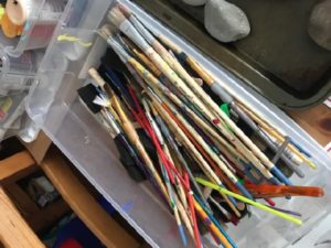 Paint brushes in bin