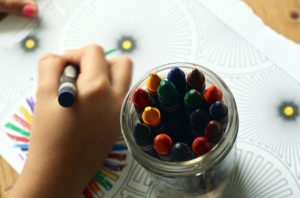 Children's hand coloring with crayons
