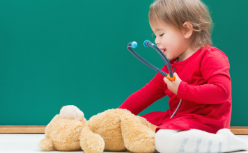 Child with Teddy Bear and Stethoscope Pediatrician Guide Featured Image
